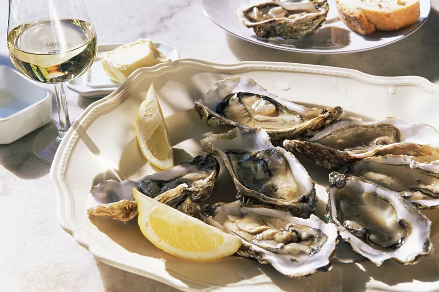 Plate Of Oysters with a glass of white wine