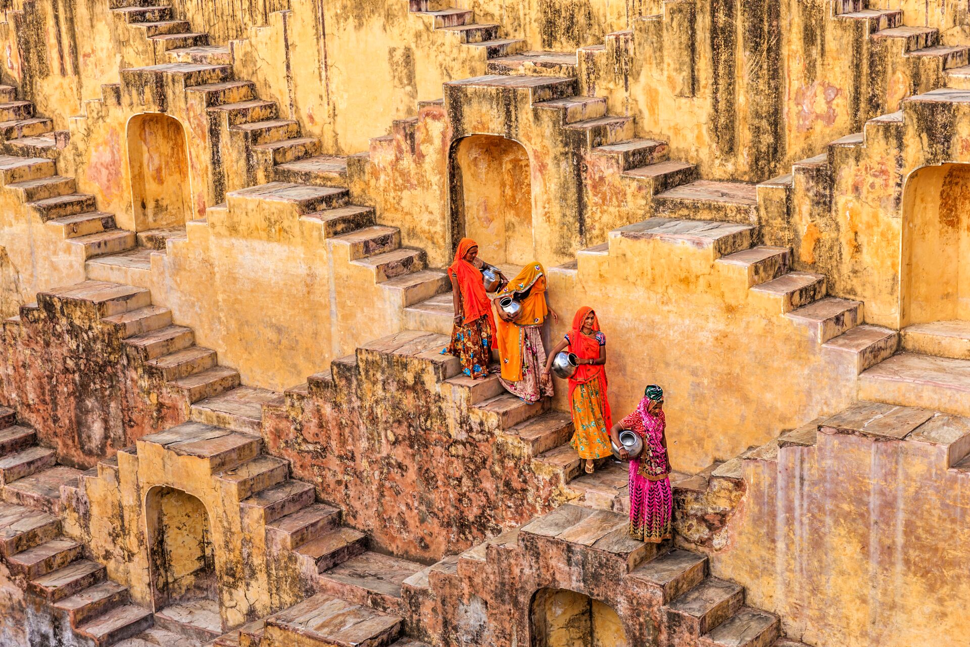 Indian Women carrying water from a stepwell near Jaipur, India