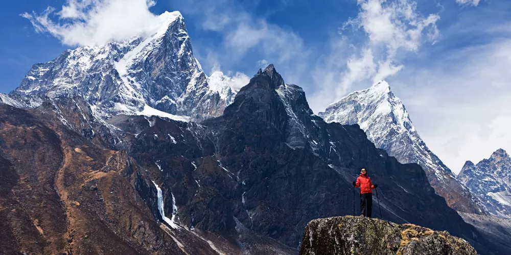 Woman looking at the Himalayas in Mount Everest National Park