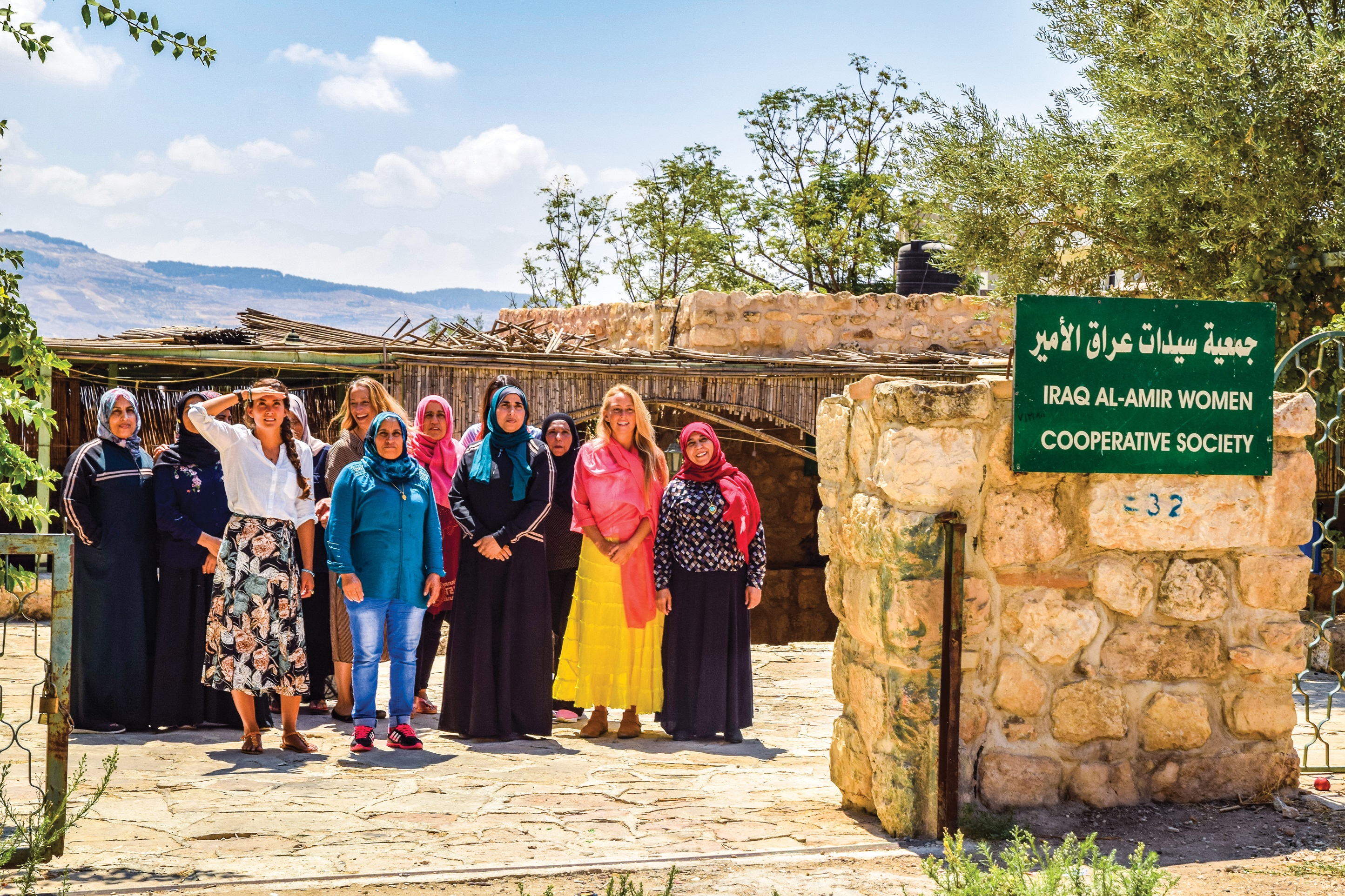 Women standing and smilling in Iraq