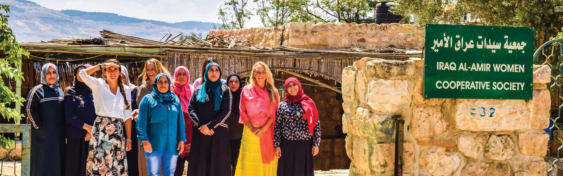 Women standing and smilling in Iraq