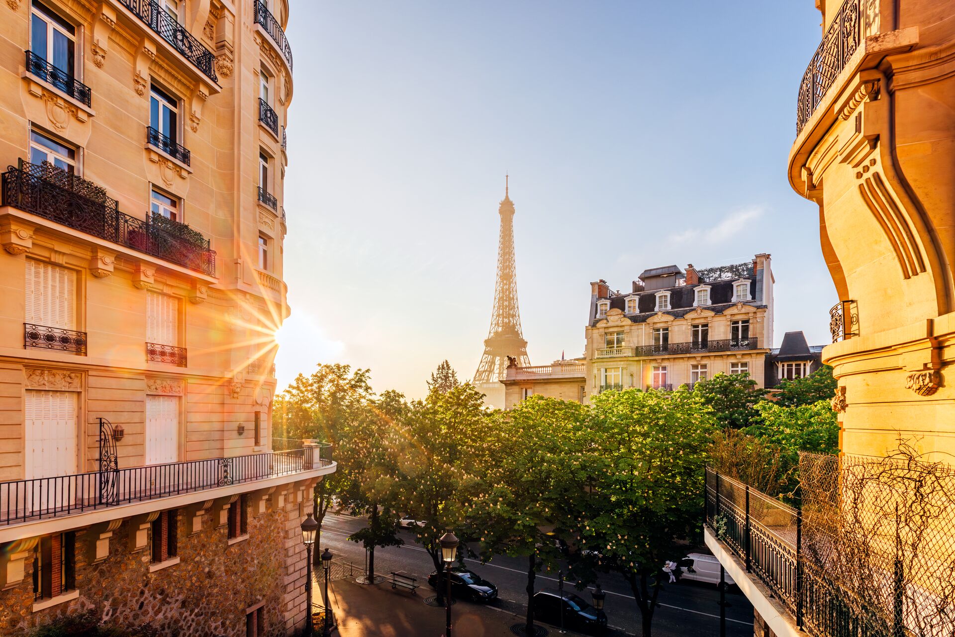 Sun rising in Paris, France with the iconic Eiffel Tower in the background