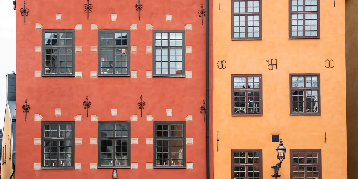 A close up of the colourful facades of Gamla Stan in Stockholm, Sweden