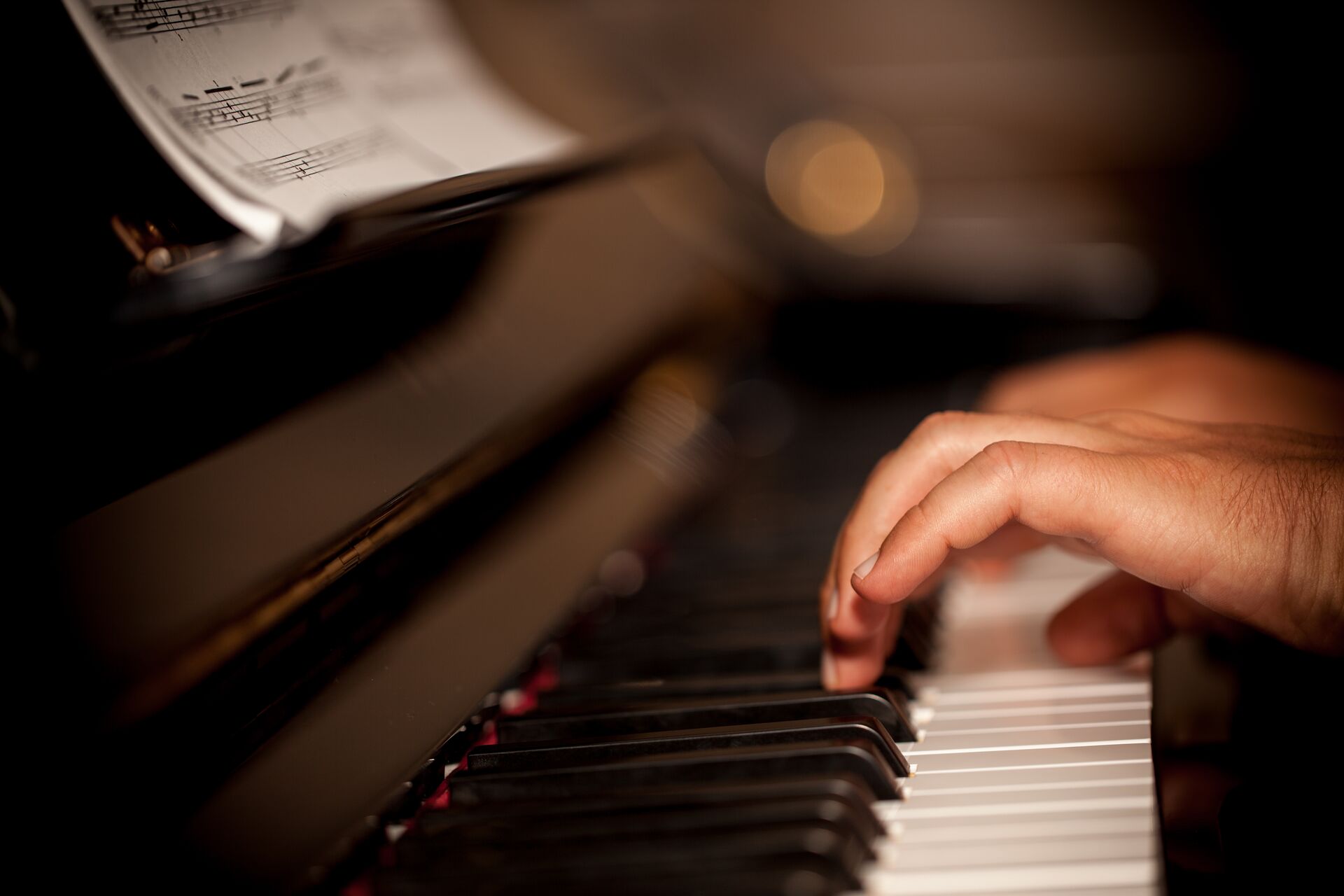 Large Person Playing Piano 1206253192