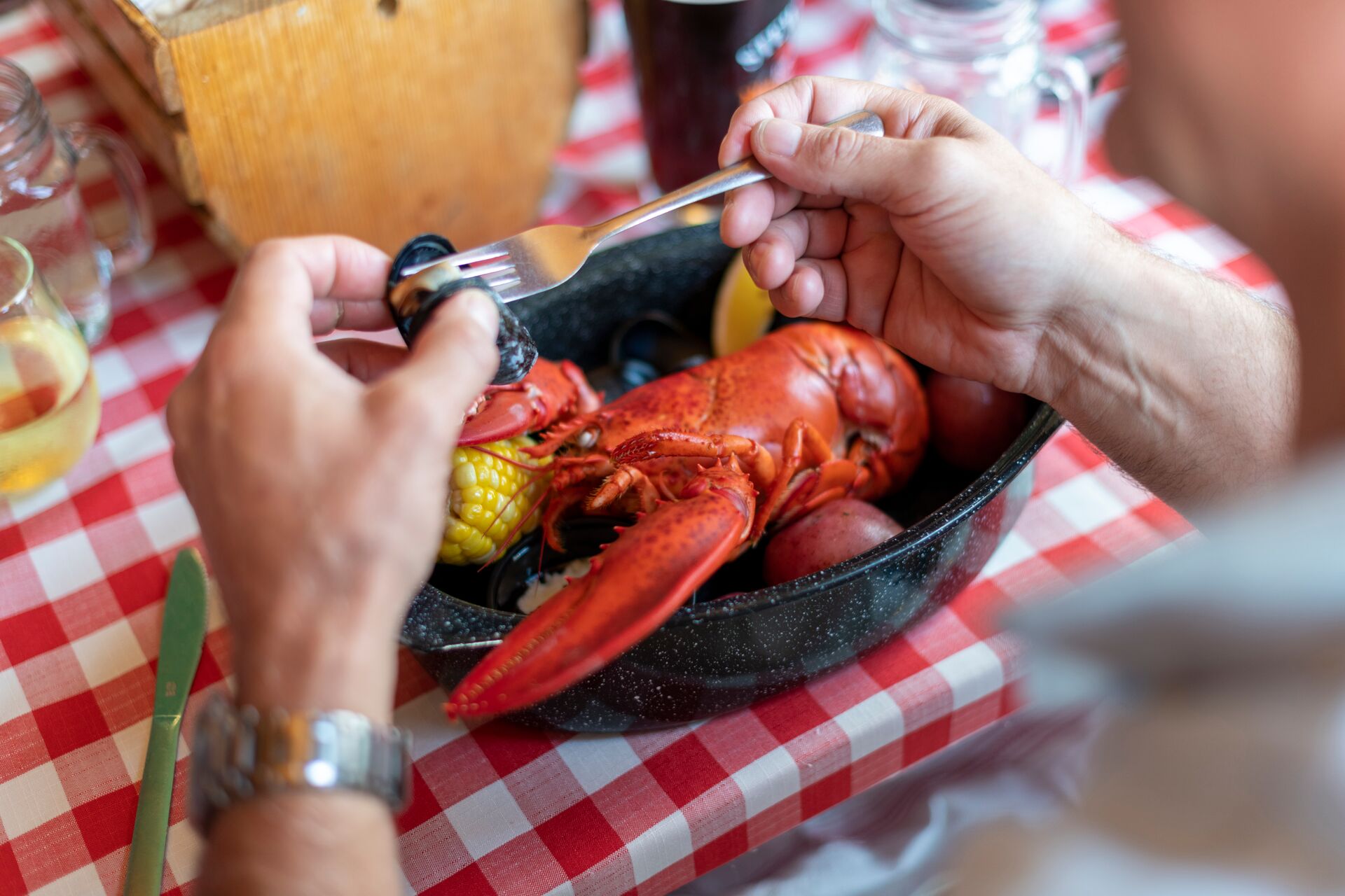Man eating a lobster in Maine, USA