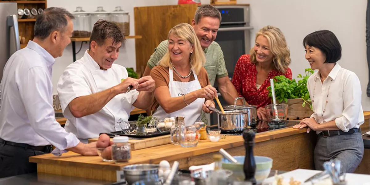 Guests enjoying a cooking demonstration
