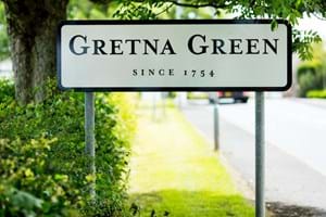 The signpost at the Scottish town of Gretna Green - famed for 'runaway' marriages, Gretna Green, Scotland