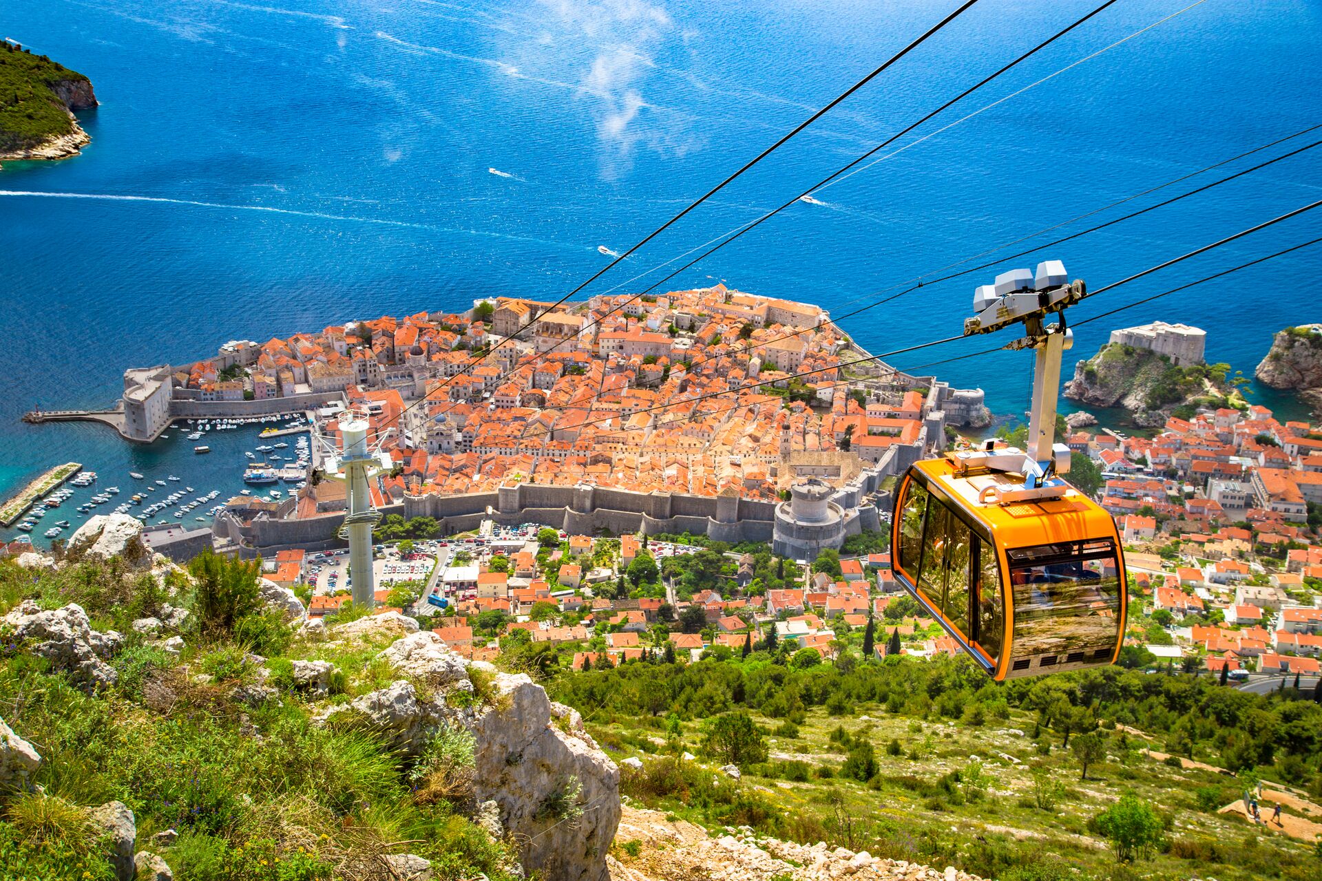 Old town off Dubrovnik with a cable car ascending Srd Mountain in Dalmatia, Croatia