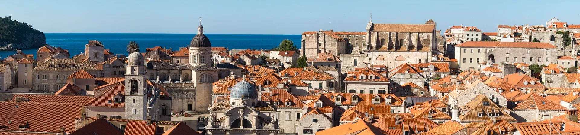 Beige stone buildings with red tiled rooftops in Dubrovnik, Croatia
