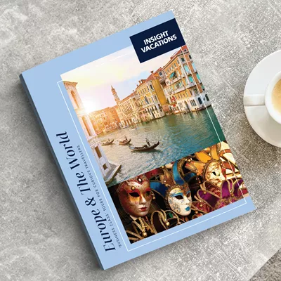 Insight Vacations brochure on table next to a cup of coffee