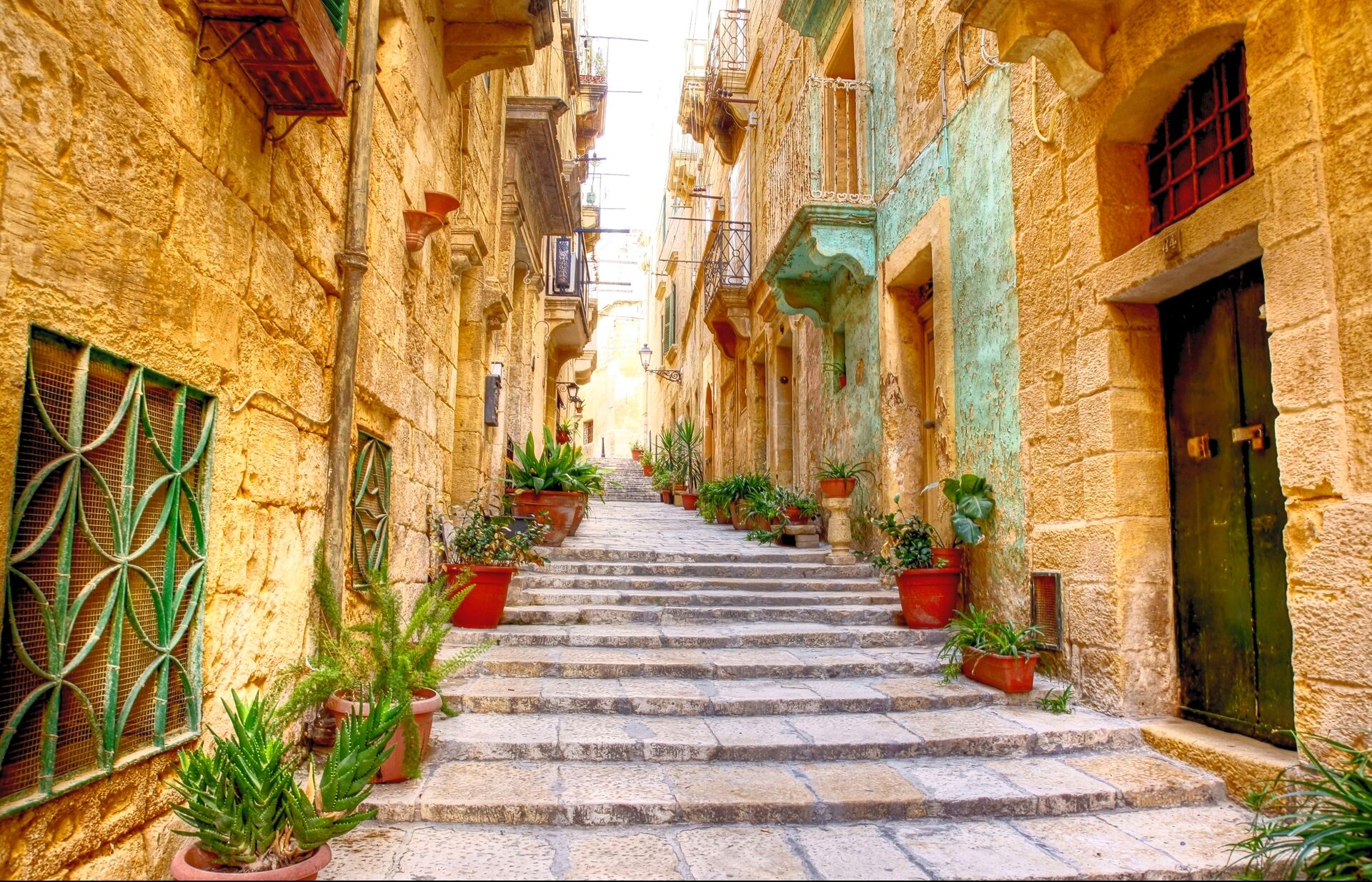 Typical narrow street with stairs in Valetta, Malta
