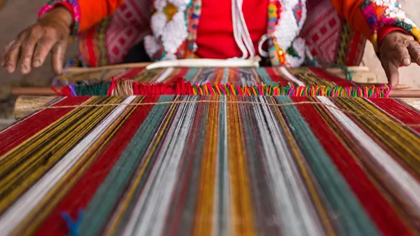 Close up of a woman weaving in Peru, South America