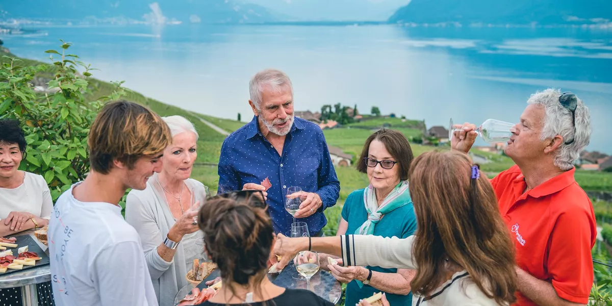 Guests enjoying local cheeses, meats and wines in the mountains around Geneva, Switzerland