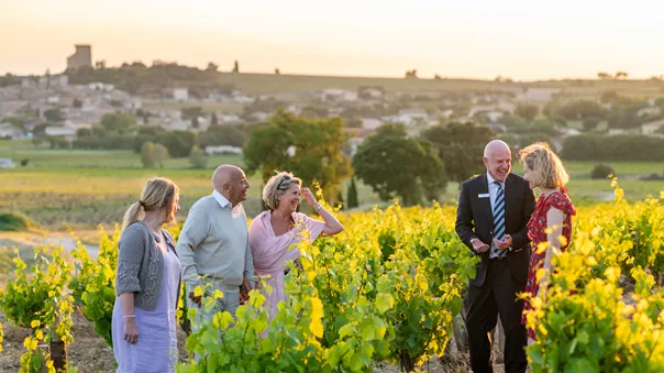 A group of people laughing on a yellow flowers field