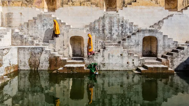 Women In Saris Carrying Water At Step Well, Jaipur, Rajasthan, India