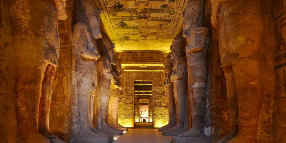 The illuminated entrance to Abu Simbel Temple in The Valley of the Kings, Egypt