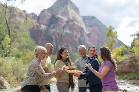 Group of people tasting food outside