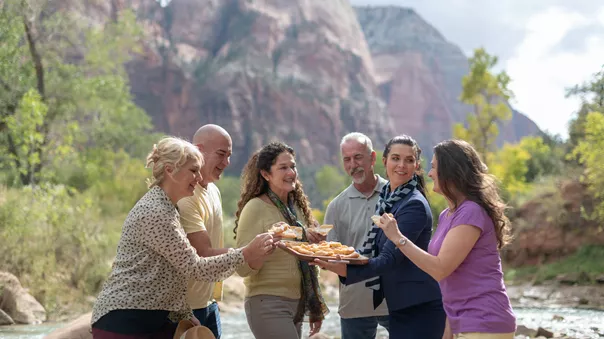 Group of people tasting food outside