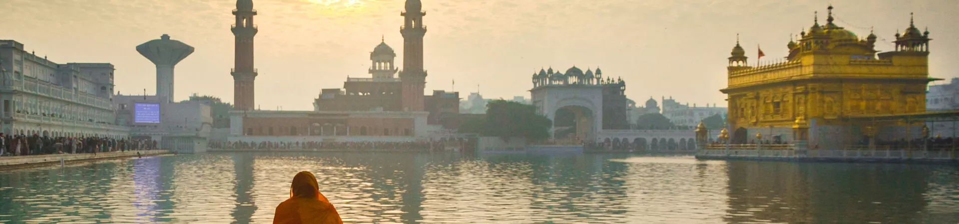 Woman praying at the Golden Temple in Amritsar, India