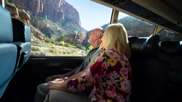 A copule looking out of their coach at Zion National Park in Utah, USA