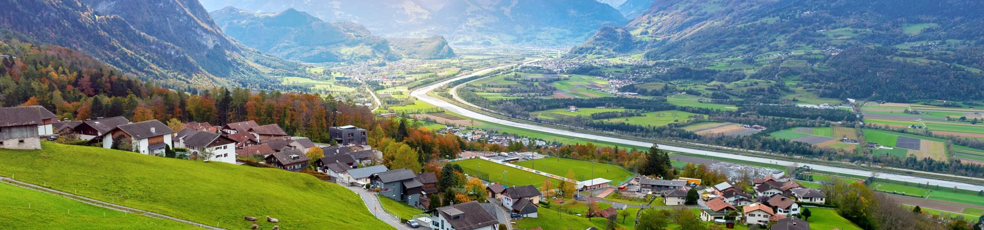 Website Banner Scenic Aerial View Of Hillside Villages In Triesenberg And The River Rhine, Natural Border Of Liechtenstein, An Alpine Country In Central Europe, To S 1223166157 (1)