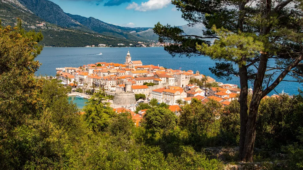 Town Of Korcula through the trees in Dalmatia, Croatia
