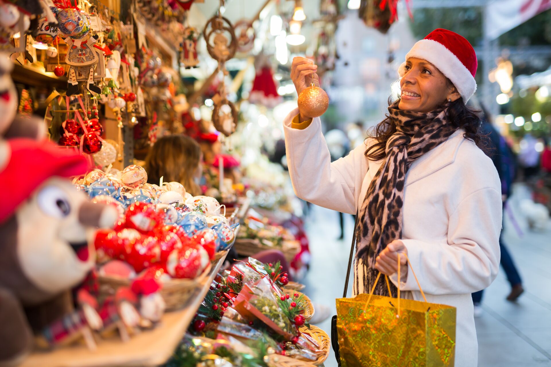 Woman selecting gifts at a Christmas market