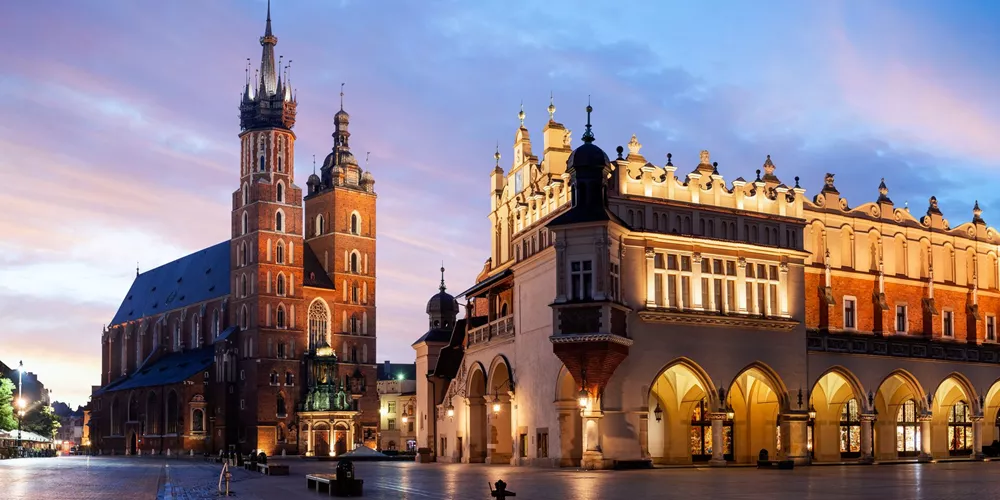 St Mary's Basilica, Bazylika Mariacka & The Cloth Hall at night in Krakow, Poland