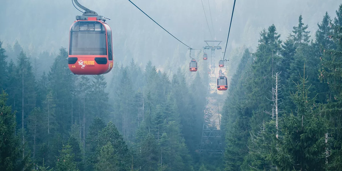 Cable car travelling to the top of Mount Pilatus Summit on a foggy day in Switzerland