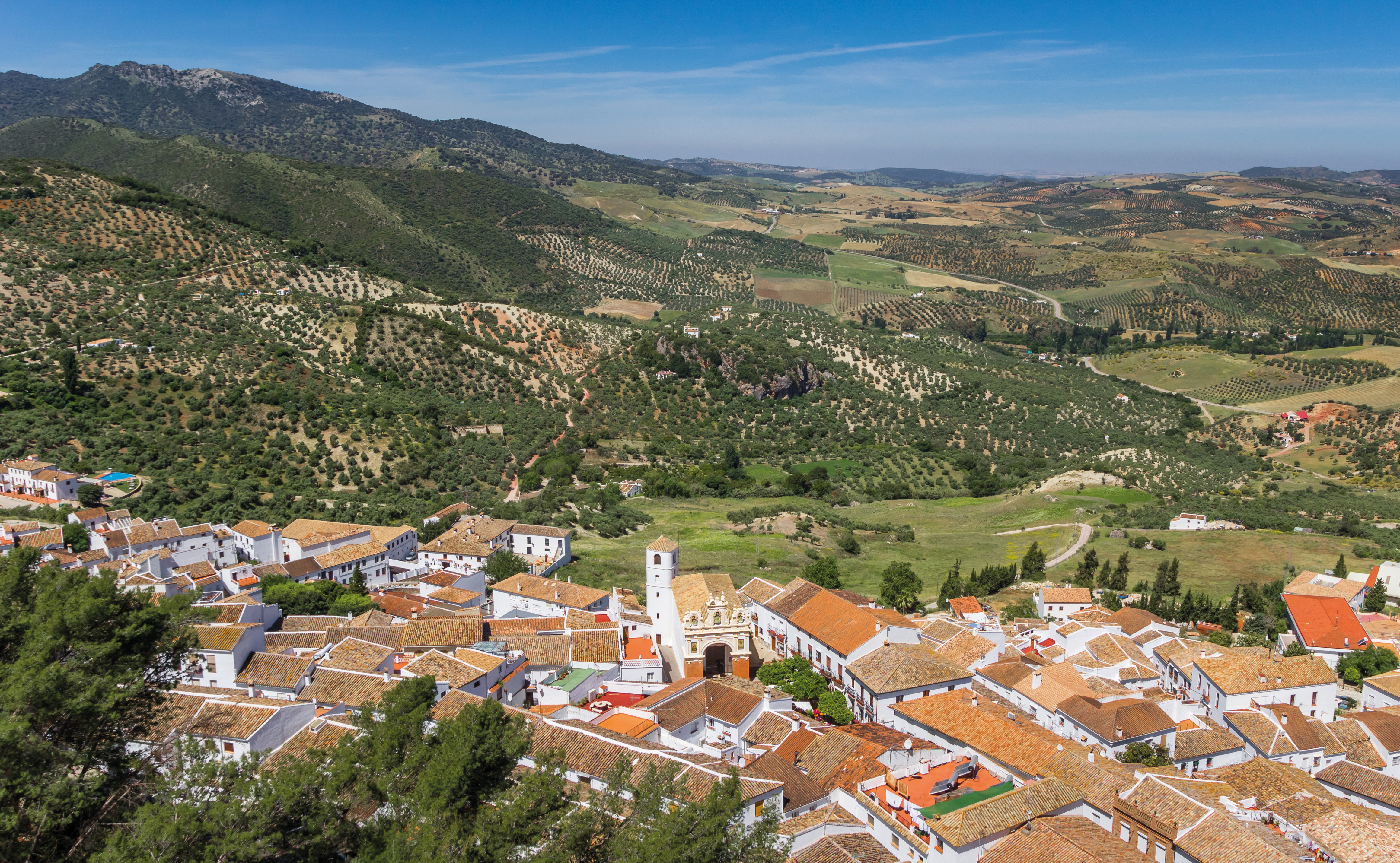 Panorama of a town among green hills