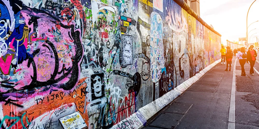 Graffiti paintings on the East Side Gallery Wall (Berliner Mauer) in Berlin, Germany