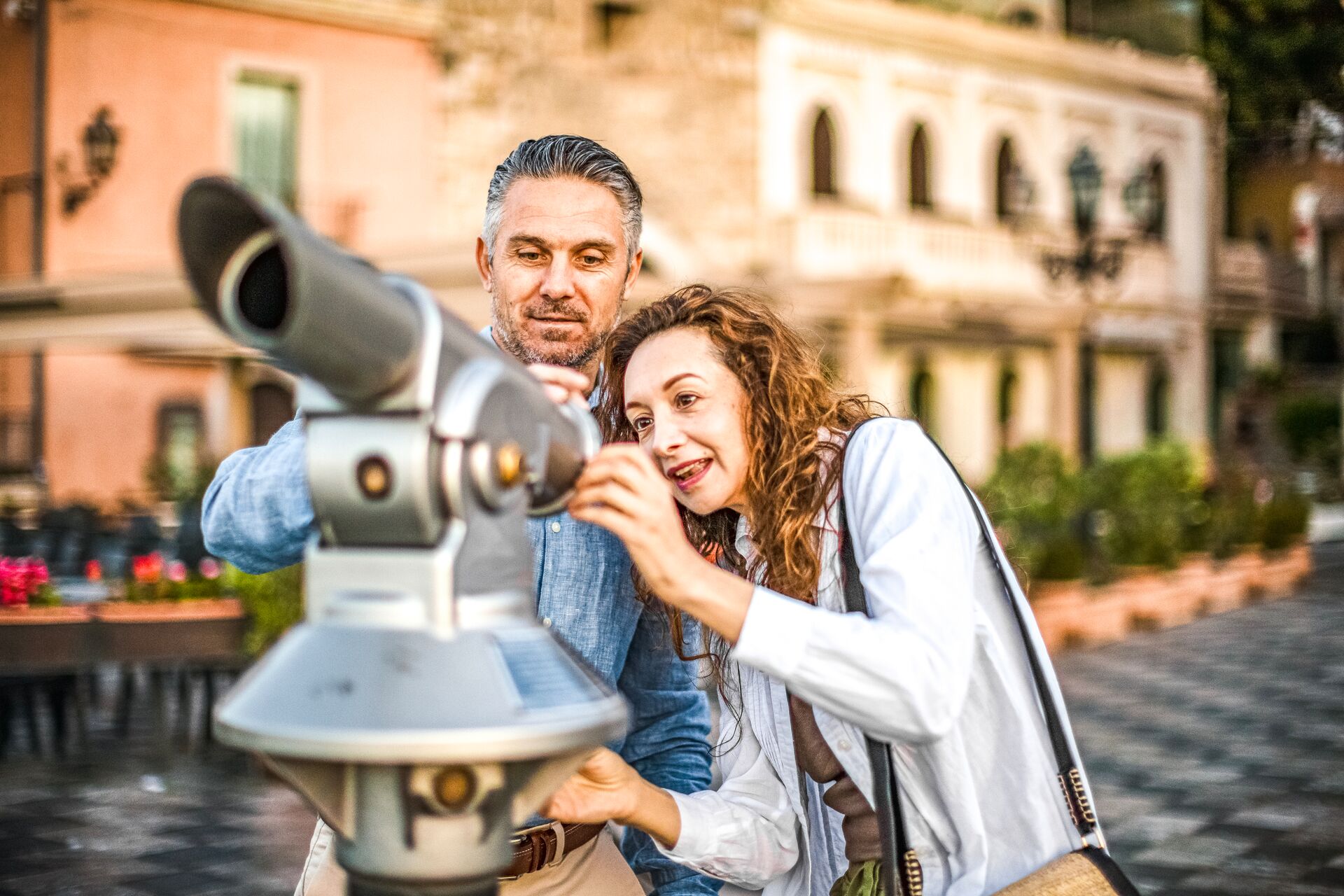 Guest looping through a periscope while exploring Taormina, Italy