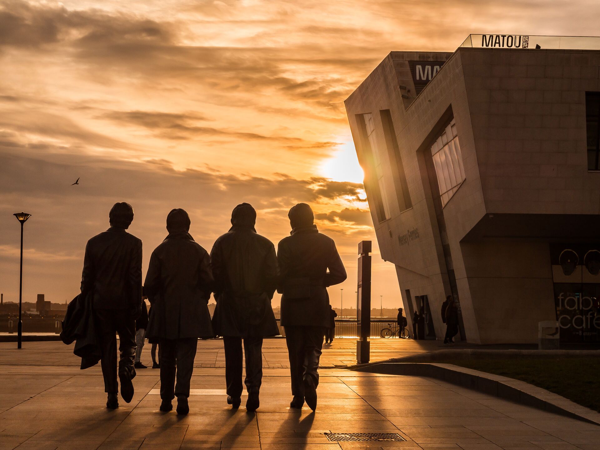 The statue of the Beatles at sunset in Liverpool, England