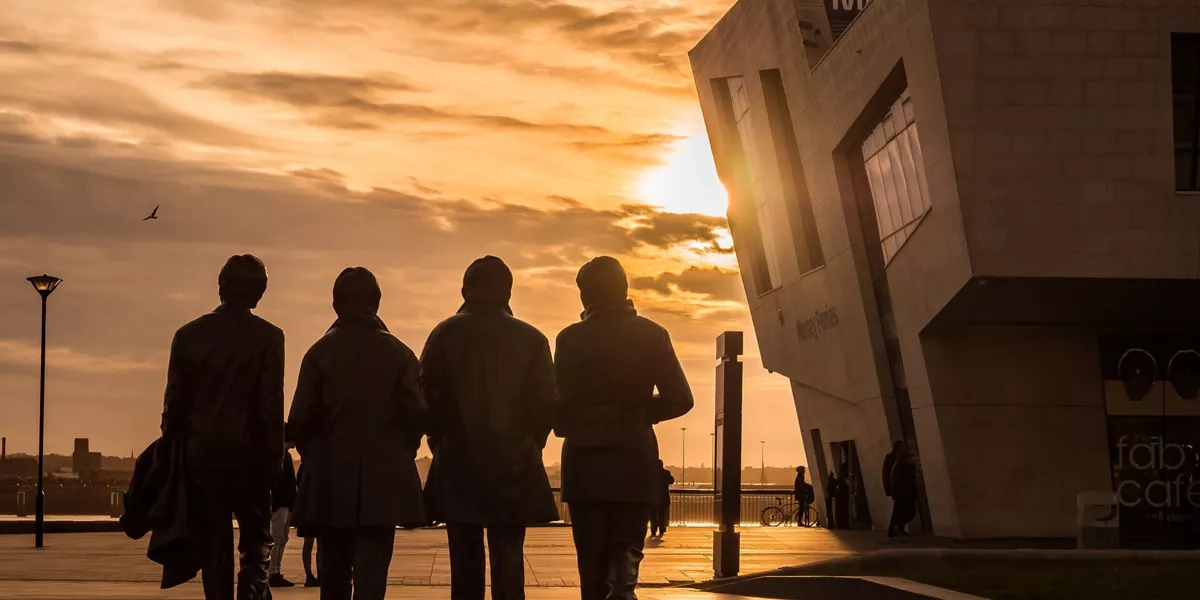 The statue of the Beatles at sunset in Liverpool, England