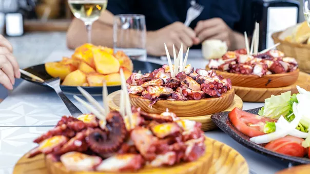 People Eating Pulpo a la Gallega in Galicia, Spain