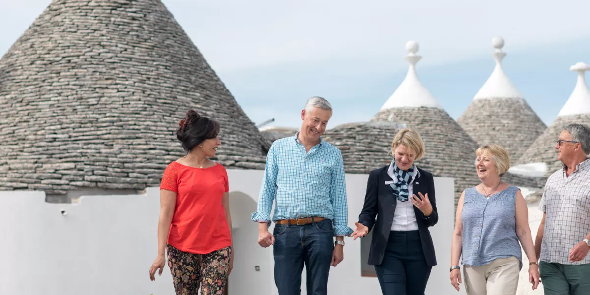 A group of tourists walking in Apuli.