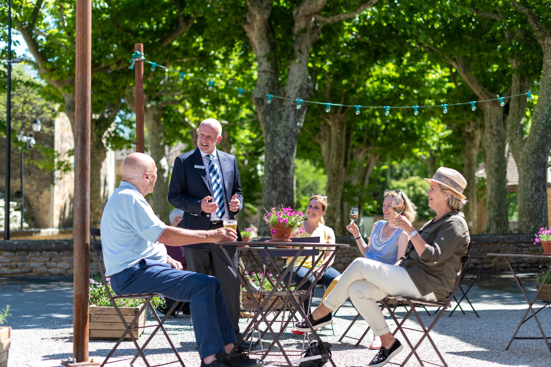 Tourists enjoying wine on a sunny day in the South of France
