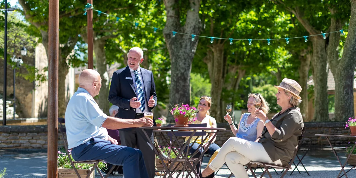 Tourists enjoying wine on a sunny day in the South of France