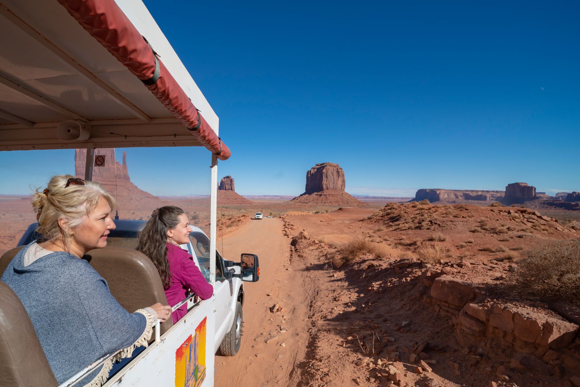Tourists on a guided tour around Monument Valley, USA