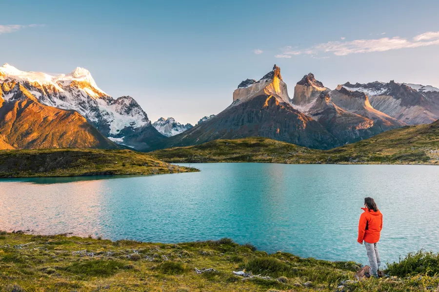 Tourist Admiring The Cordillera Paine In Torres Del Paine National Park, Chile