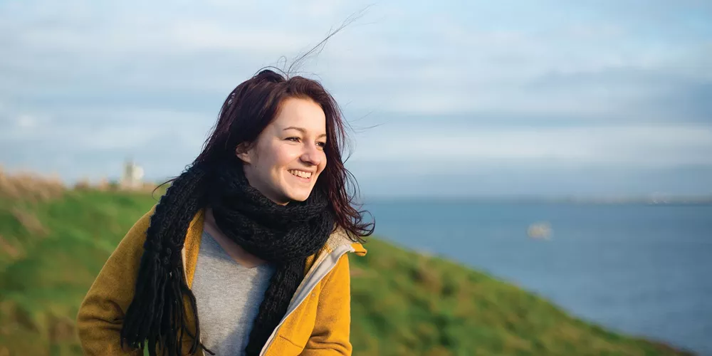Woman smiling while on holiday in Ireland