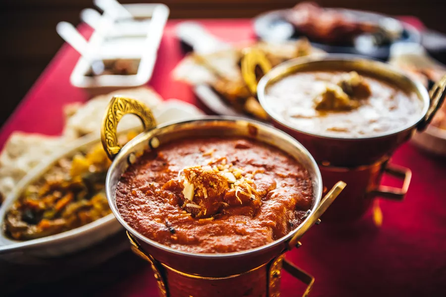 Indian Feast With Butter Chicken, Chicken Tandoori, Lamb Curry, Vegetable Curry, Samosas, Pakoras, Bhajis, Naan Bread And Basmati Rice On A Table Nort 889609260