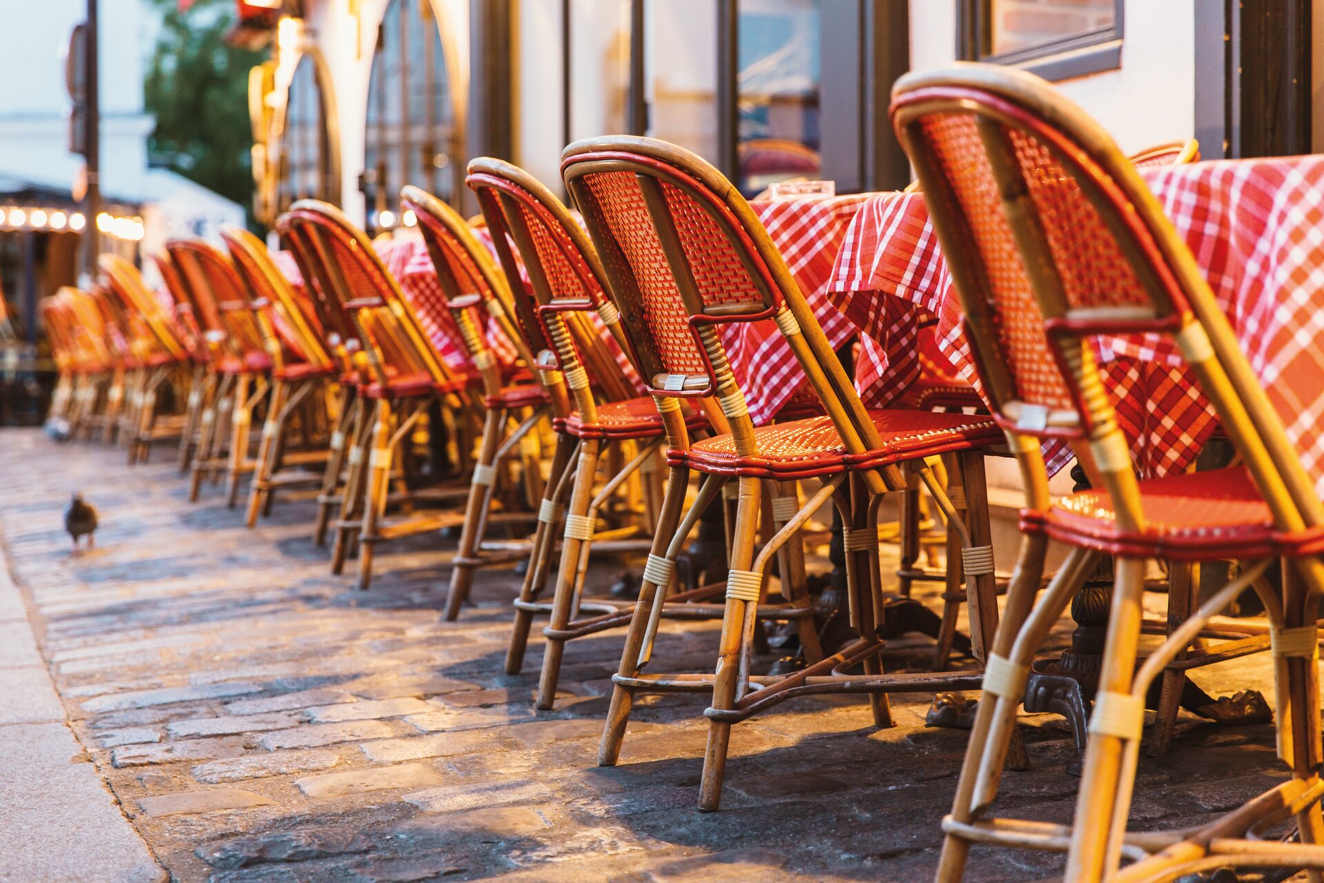 Chairs And Table At Typical Sidewalk Cafe In Paris, France