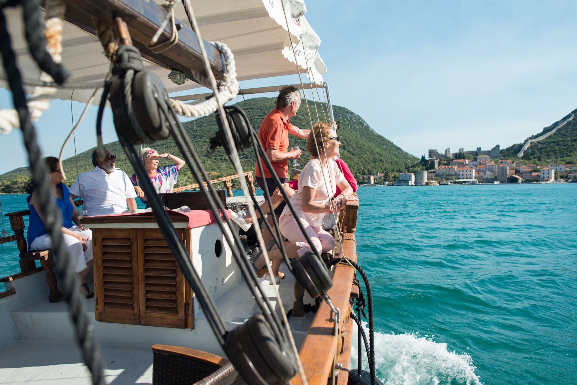 Guests looking out at the view while sailing through the Dalmatian Coast in Croatia