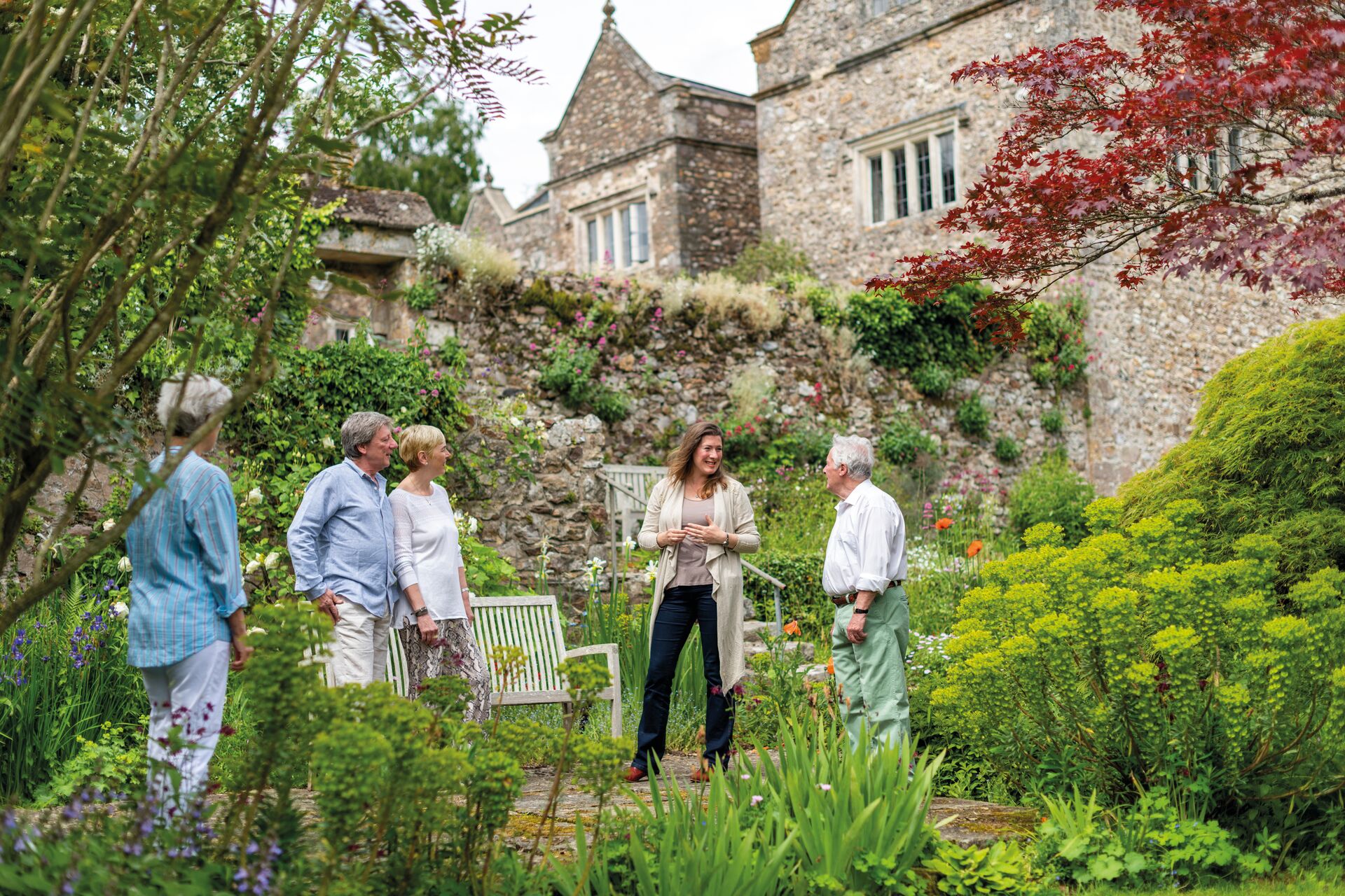 Guest talking to an expert in the garden at Sand House in Devon, England