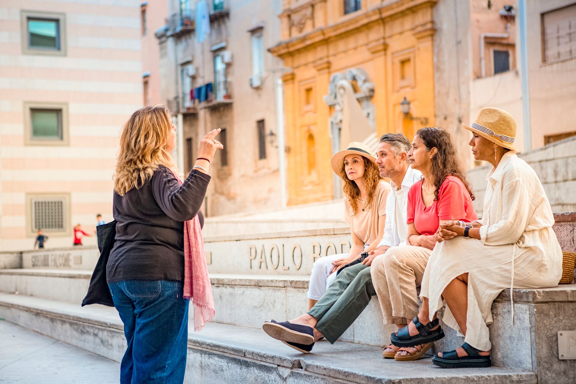 Guests joining a local expert on a MAKE TRAVEL MATTER anti-mafia walking tour in Palermo, Sicily