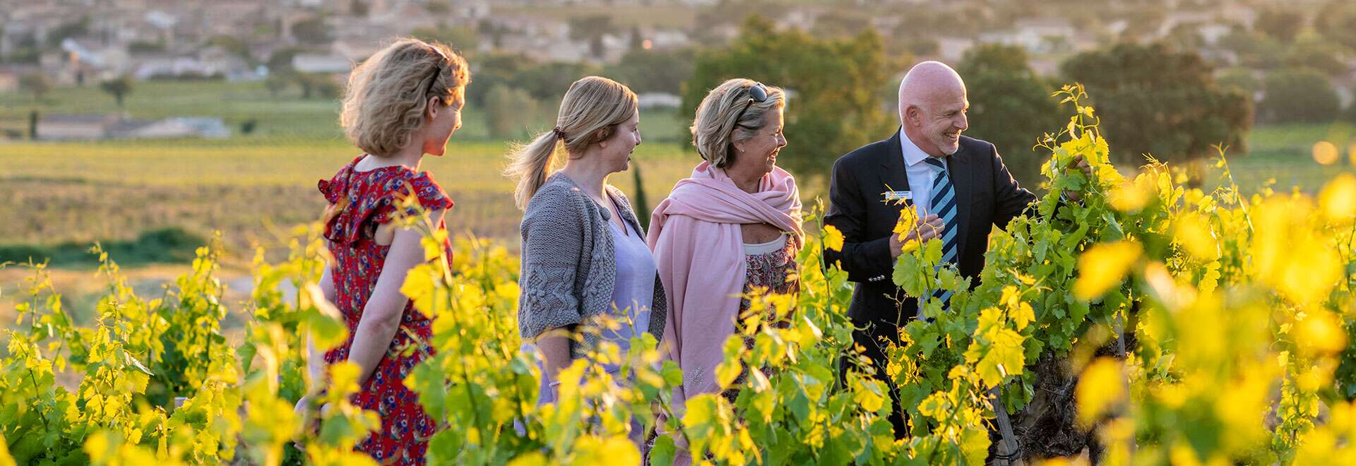 Tourists With Tour Director On Meadow