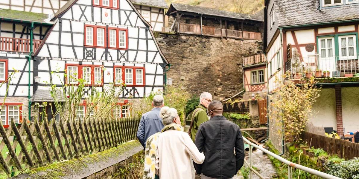 Tourists admiring traditional houses in Bacharach, Germany