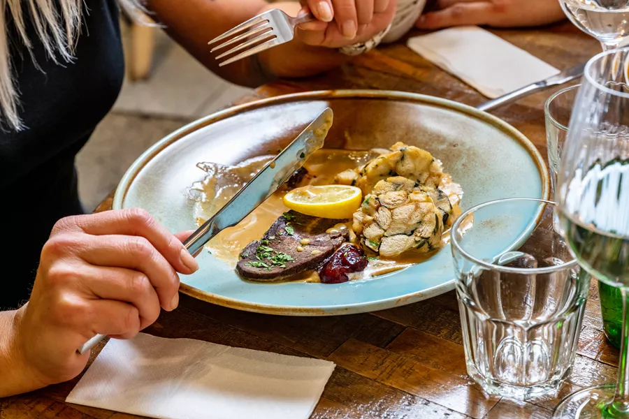Traditional Czech svickova sauce, beef and dumpling in restaurant