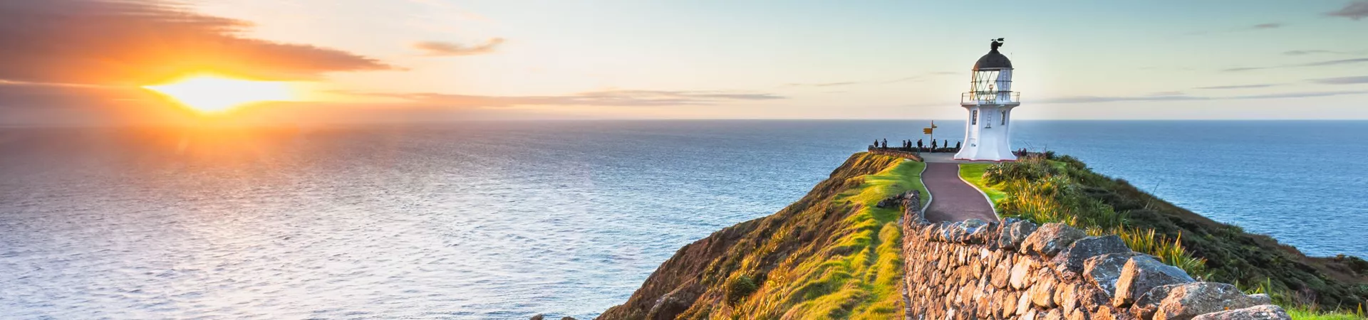 The sun setting over Cape Reinga on the North Island of New Zealand